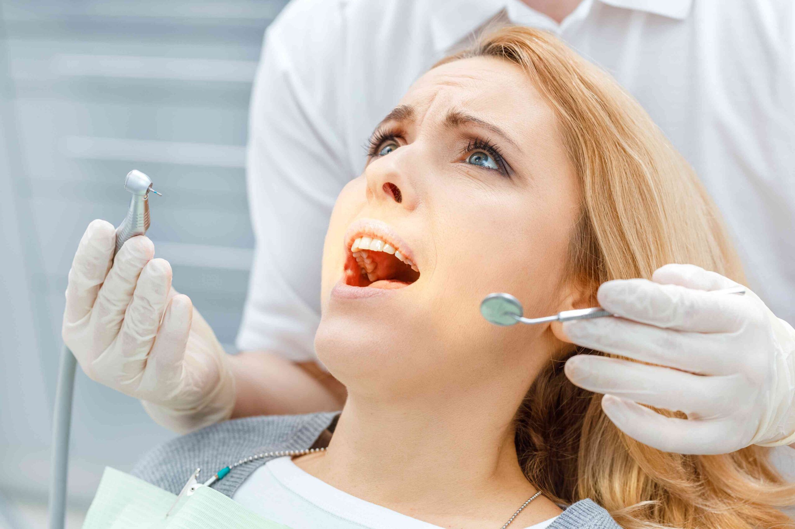 invisalign-bite-alignment-guide Patient receiving a dental examination for tooth pain.